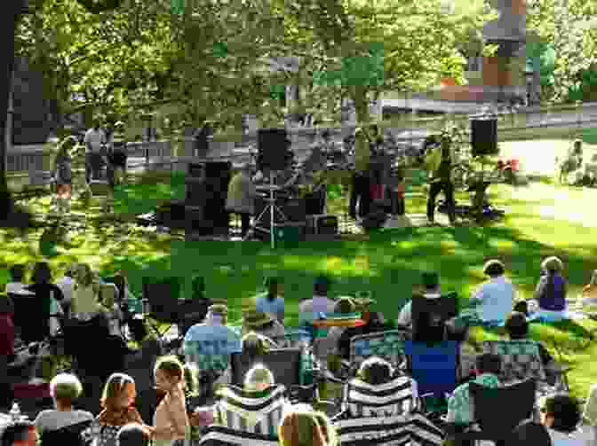 A Photograph Of A Group Of People Sitting In A Garden, Listening To A Live Music Performance. The Garden Goes On V A McGuinness